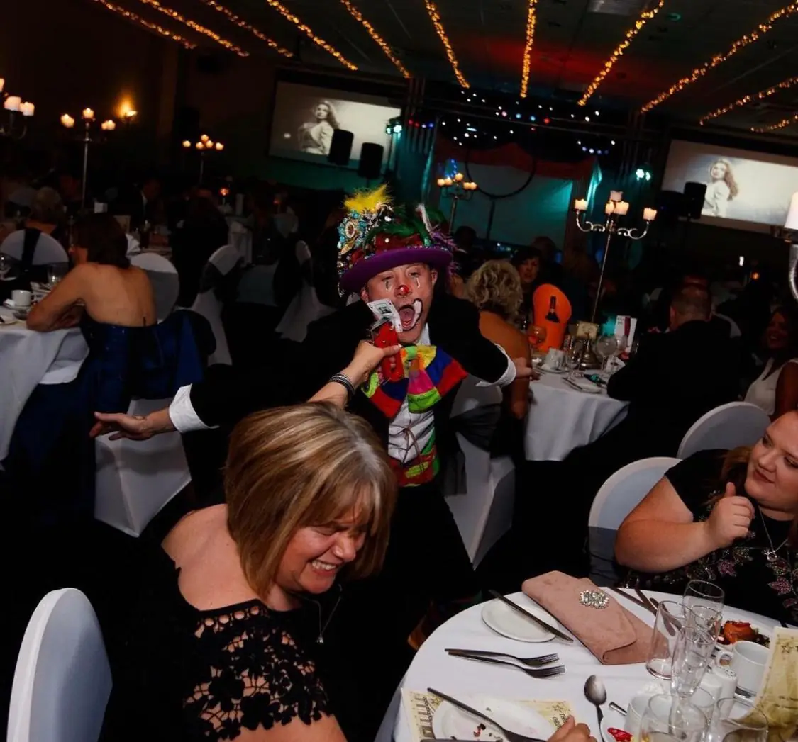 Circus performers working the room at a banquet