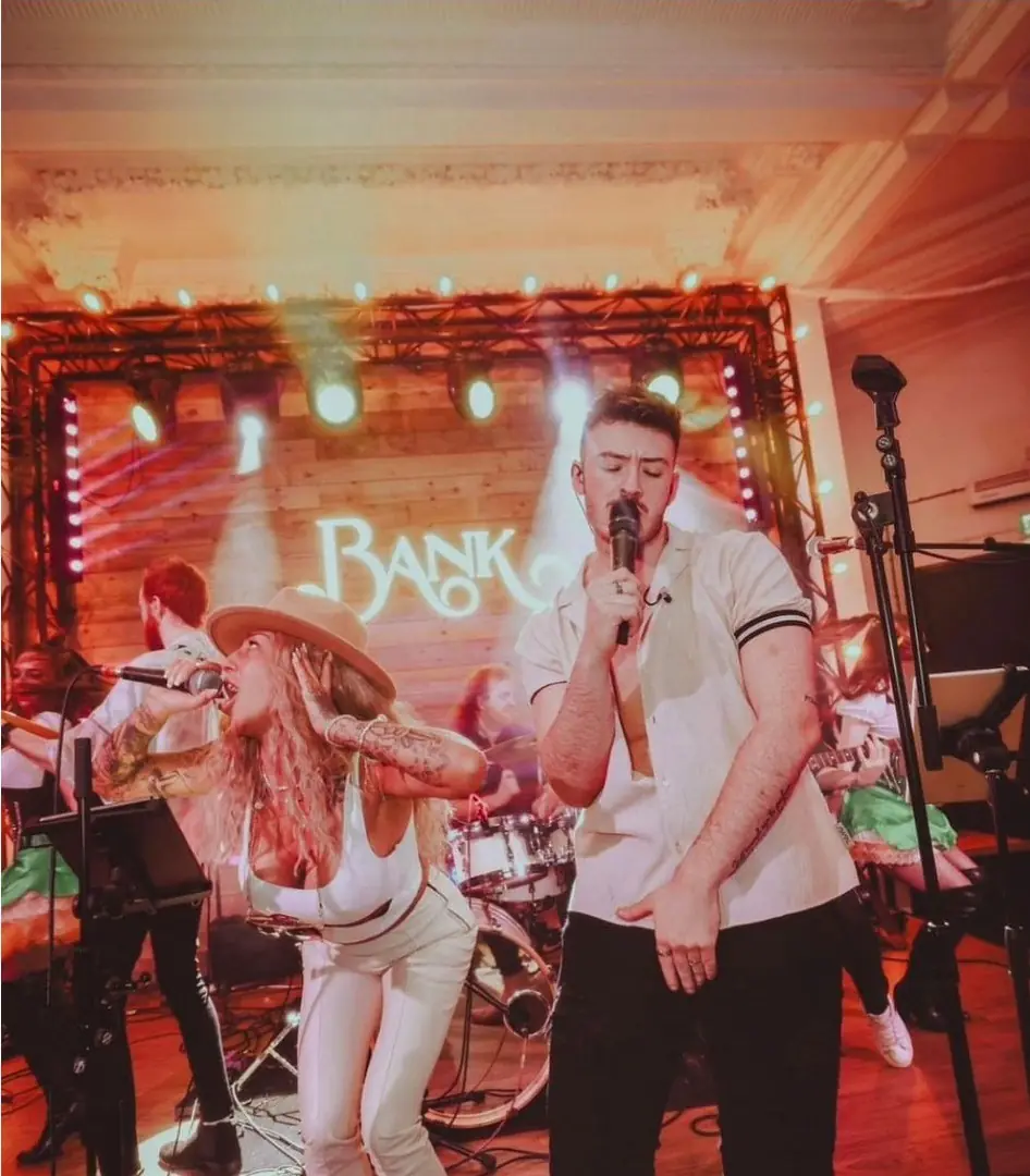 Live band and performers on a festival stage