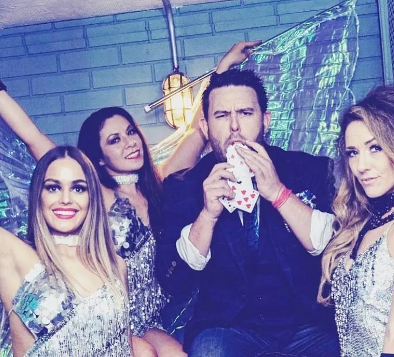 Magician entertaining a table of guests